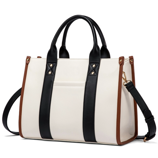 Gia vegan leather handbag in white and black with adjustable shoulder strap.