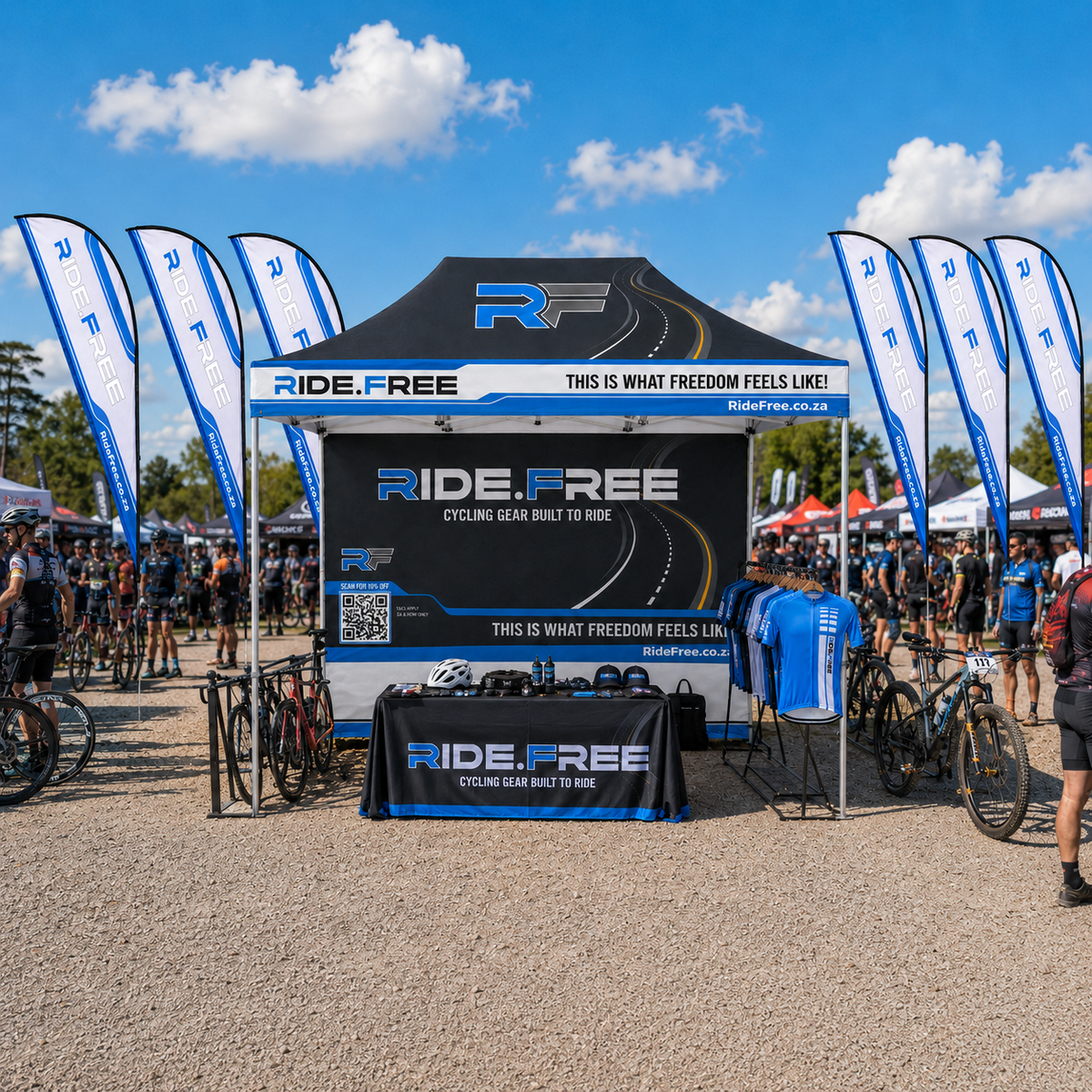 Ride Free branded event stand with gazebo, flags and apparel