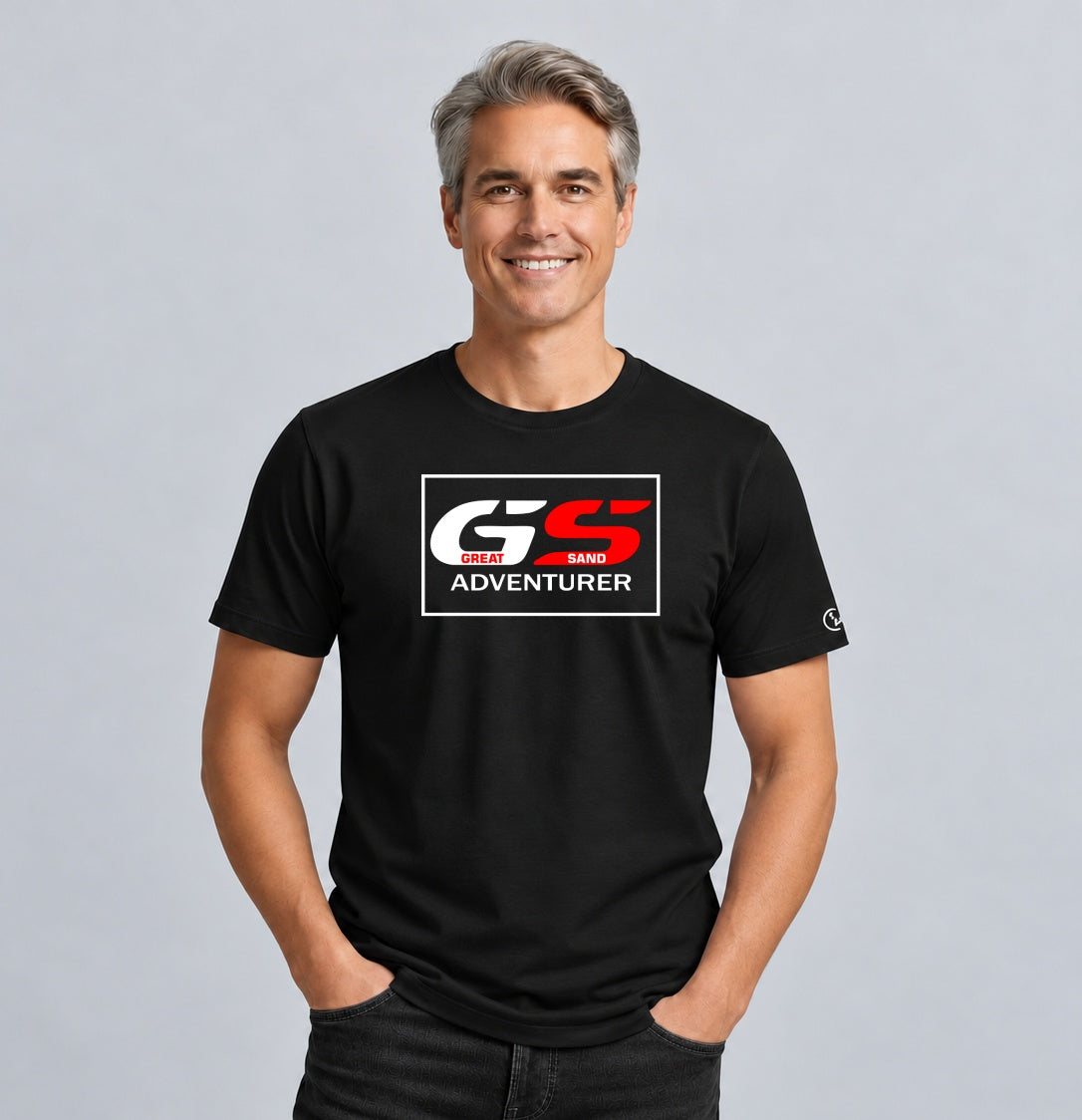 Male model wearing a black Stylingo GS - Great Sand Adventurer motorcycle graphic T-shirt in a casual lifestyle setting.