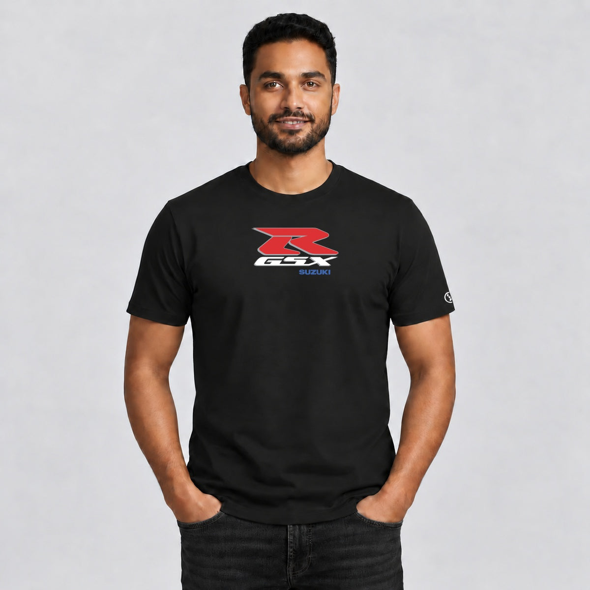Male model wearing a black Stylingo Suzuki GSX R motorcycle graphic T-shirt in a casual lifestyle setting.