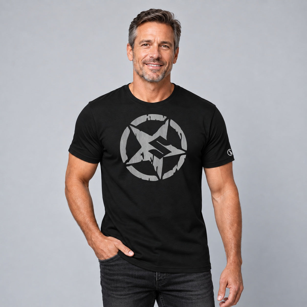 Male model wearing a black Stylingo Suzuki Punisher motorcycle graphic T-shirt in a casual lifestyle setting.